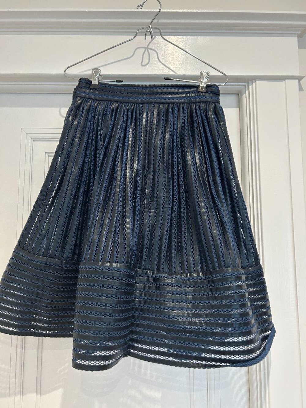 Maje James coated mesh Skirt in navy blue with pleated faux leather details
